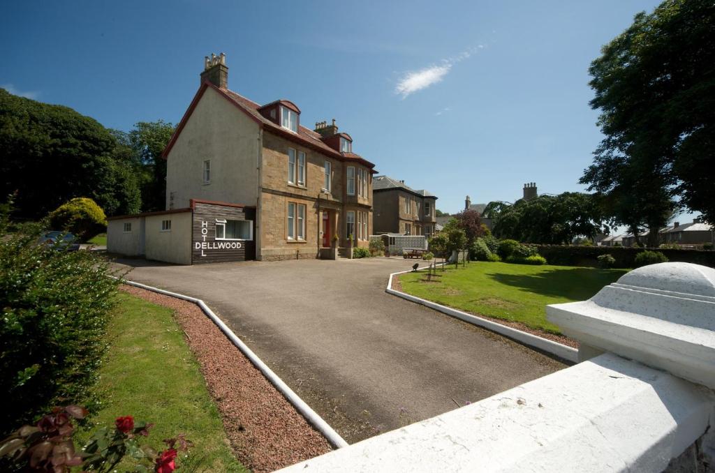 a house with a road in front of it at Dellwood Hotel in Campbeltown