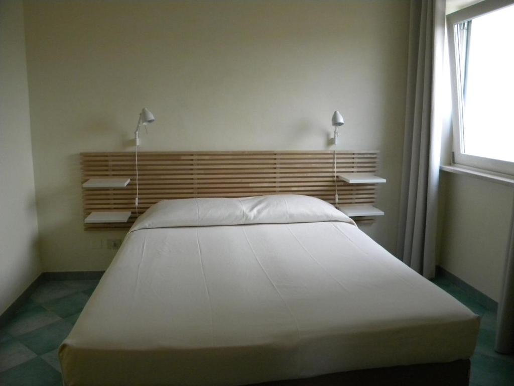 Postel nebo postele na pokoji v ubytování Albergo Villa Anna