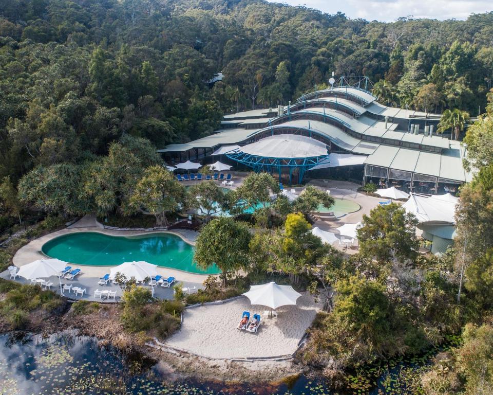 an aerial view of a resort with two pools at Kingfisher Bay Resort in K'gari Island (Fraser Island)