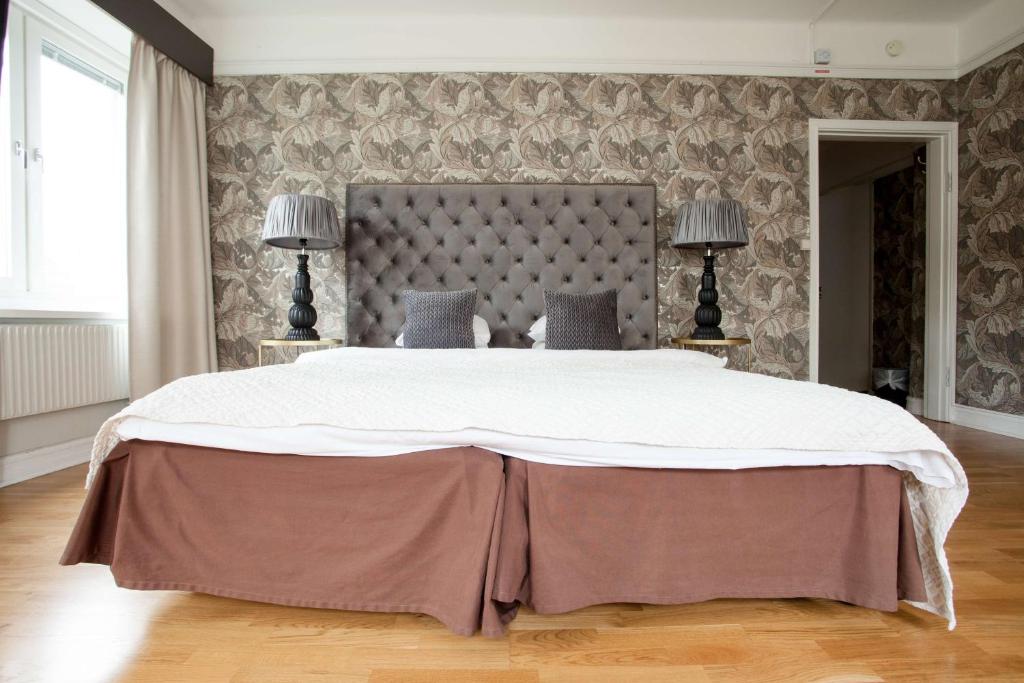 Postel nebo postele na pokoji v ubytování Centric Hotel