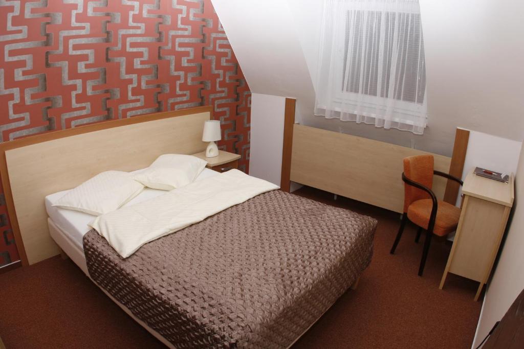 Postel nebo postele na pokoji v ubytování Wellness Hotel Diana