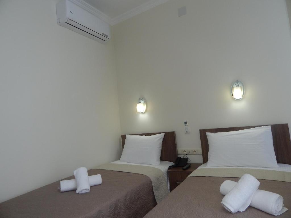 Postel nebo postele na pokoji v ubytování Hotel Belugo