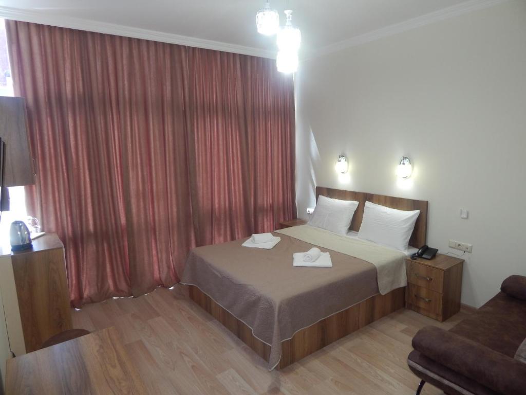 Postel nebo postele na pokoji v ubytování Hotel Belugo