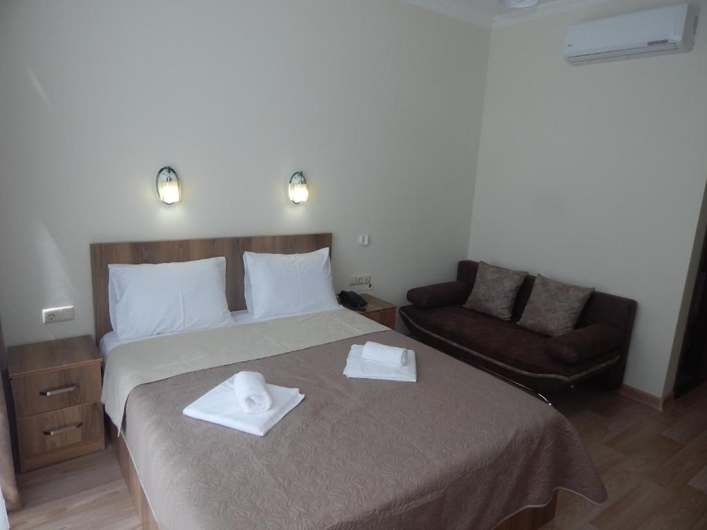 Postel nebo postele na pokoji v ubytování Hotel Belugo
