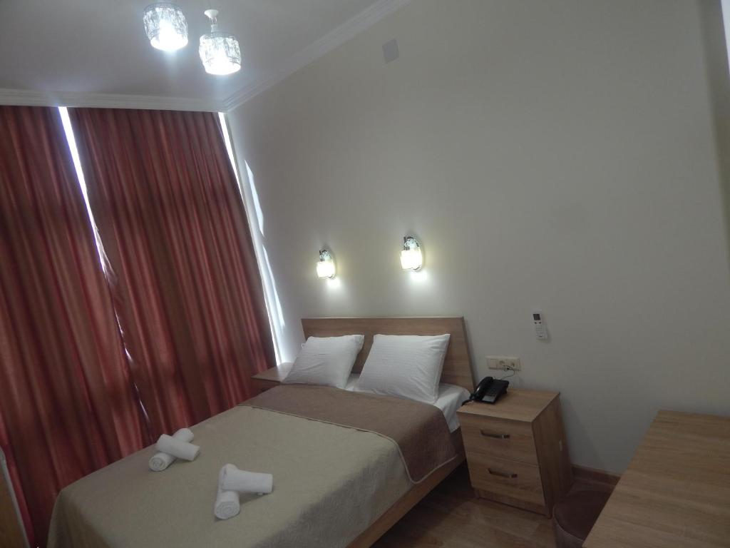 Postel nebo postele na pokoji v ubytování Hotel Belugo