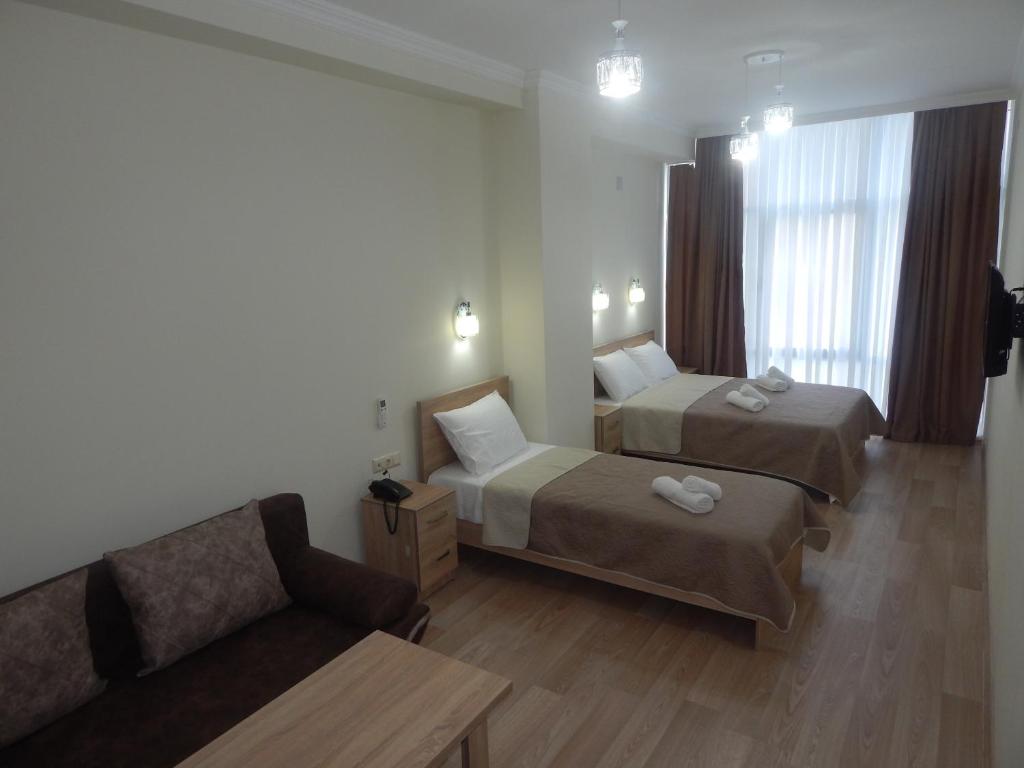 Postel nebo postele na pokoji v ubytování Hotel Belugo