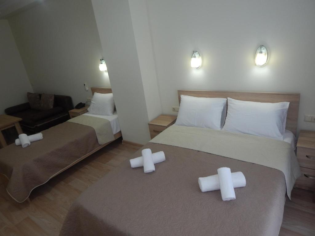 Postel nebo postele na pokoji v ubytování Hotel Belugo