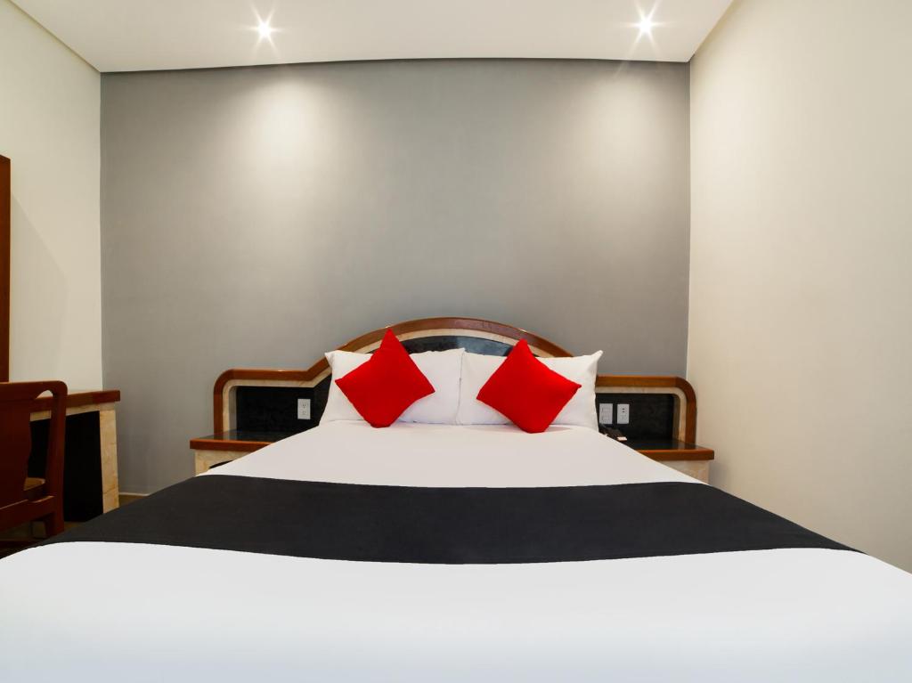 Postel nebo postele na pokoji v ubytování Hotel Monarca