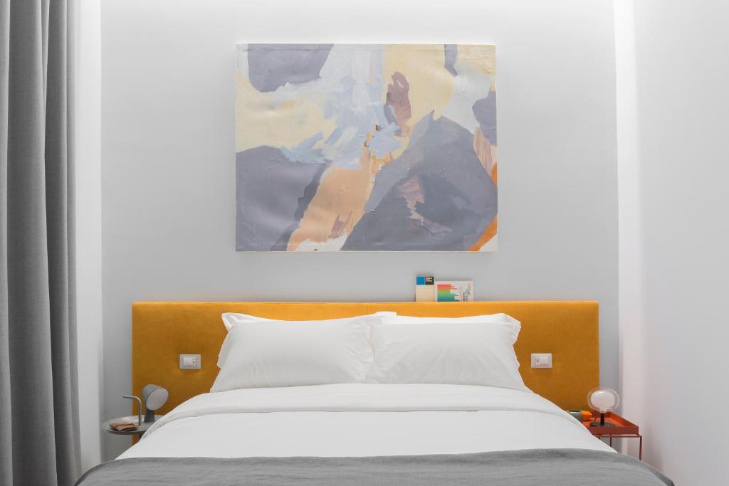 Postel nebo postele na pokoji v ubytování The Radical Hotel Roma