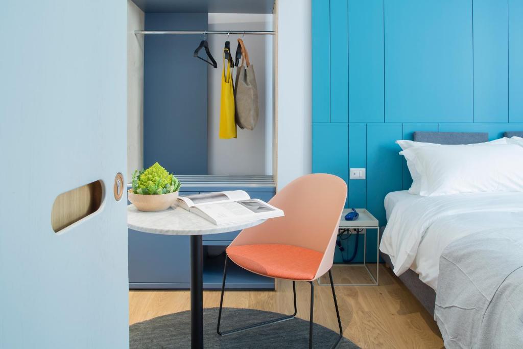 Postel nebo postele na pokoji v ubytování The Radical Hotel Roma