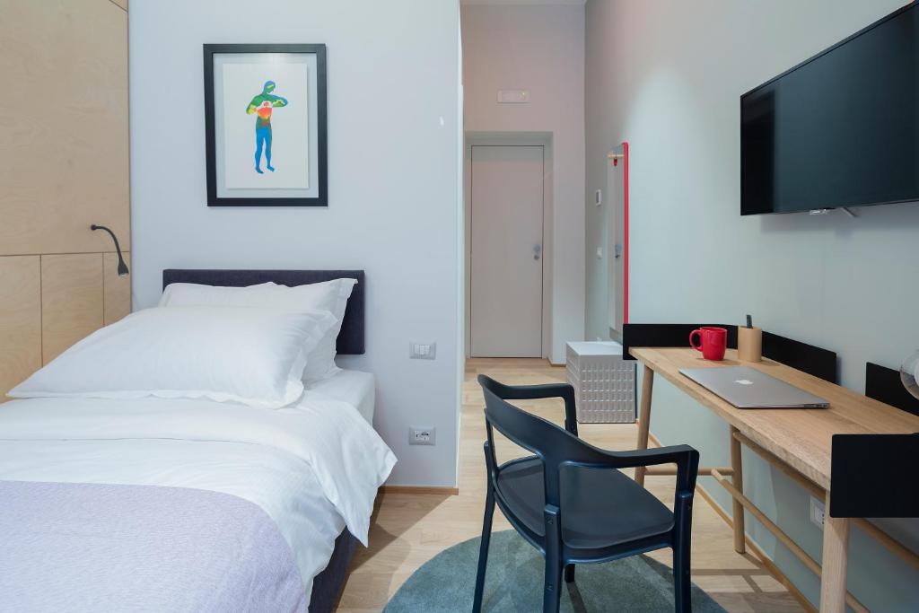 TV a/nebo společenská místnost v ubytování The Radical Hotel Roma