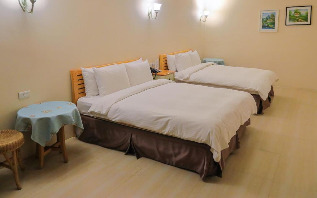 Postelja oz. postelje v sobi nastanitve Jing Guan Hotel