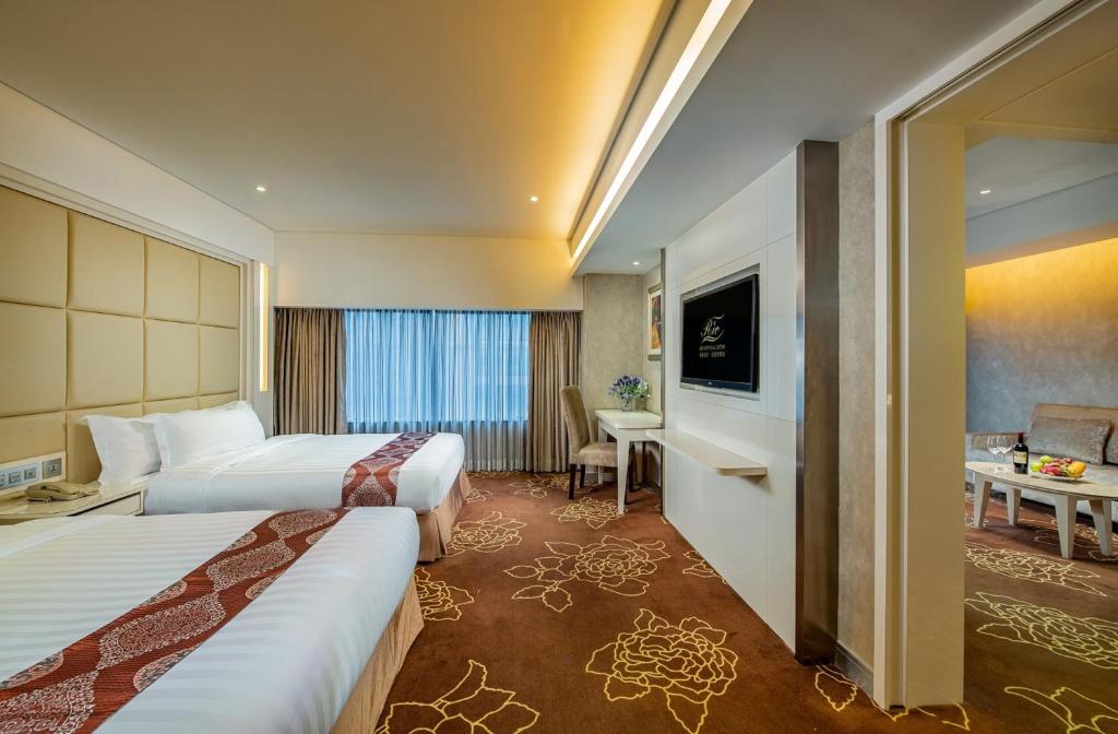 Postel nebo postele na pokoji v ubytování Rio Hotel