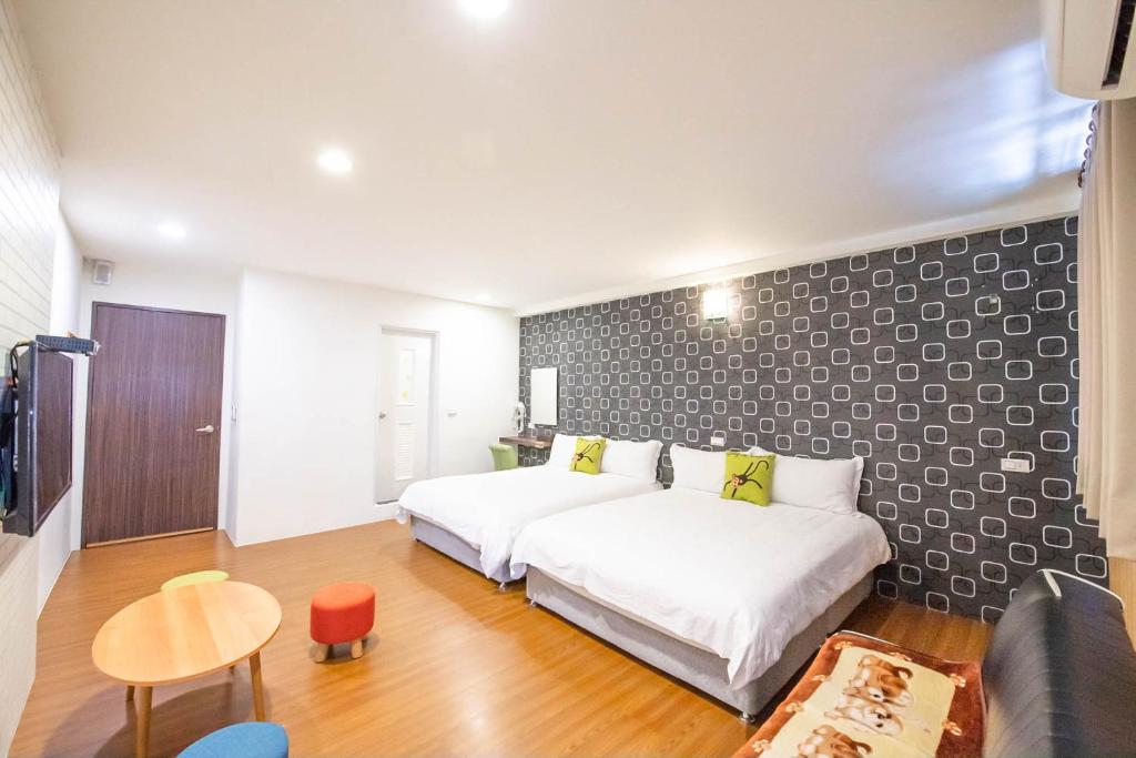 Postel nebo postele na pokoji v ubytování Luodong Nightmarket Homestay