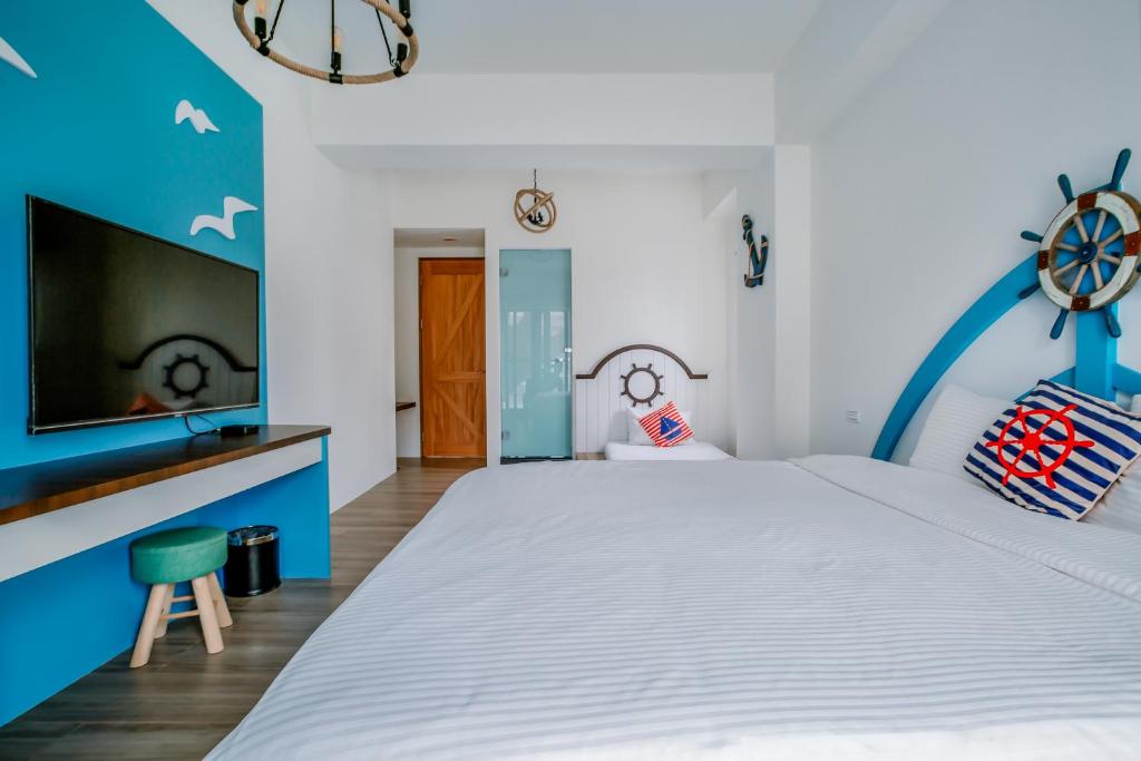 Postel nebo postele na pokoji v ubytování Party of the Ocean B&B