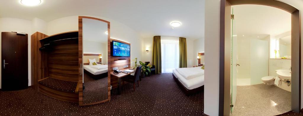 Postel nebo postele na pokoji v ubytování Wohlfühl-Hotel Neu Heidelberg