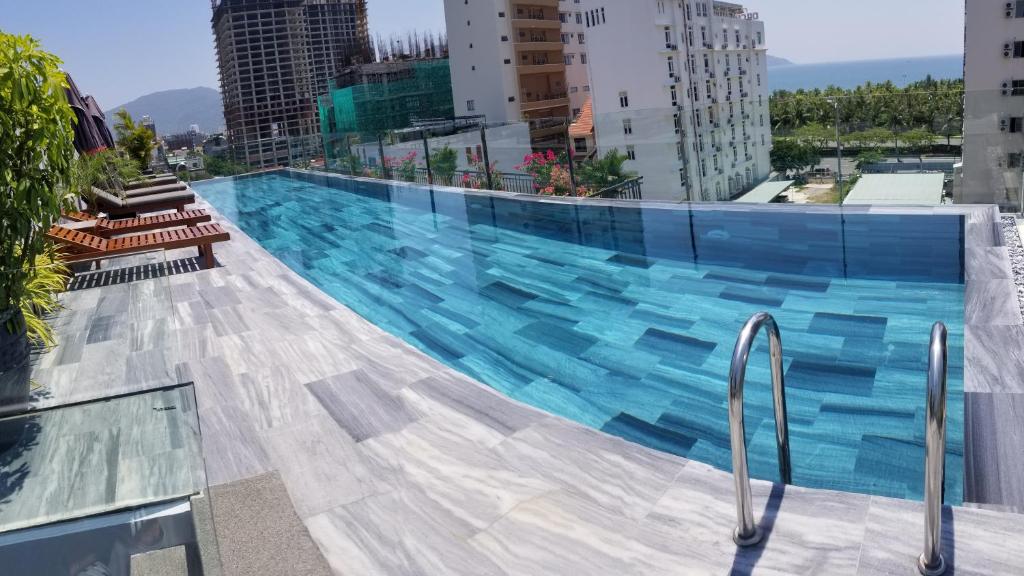 a large swimming pool on top of a building at Infinity Pool - 5 min walk to beach - Sekong Apartment in Da Nang