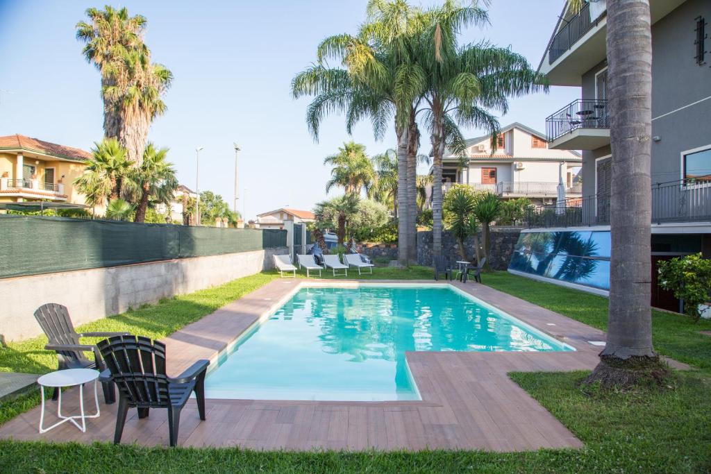 a swimming pool in the backyard of a house at Antichi Ricordi in Aci SantʼAntonio