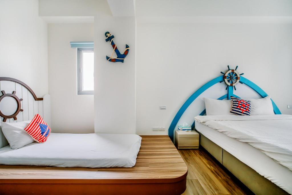 Postel nebo postele na pokoji v ubytování Party of the Ocean B&B