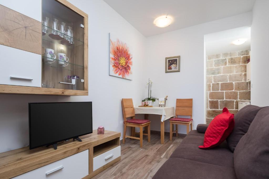 TV a/nebo společenská místnost v ubytování The Beach Suites