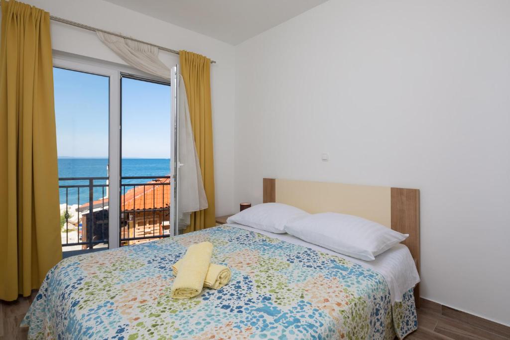 Postel nebo postele na pokoji v ubytování The Beach Suites