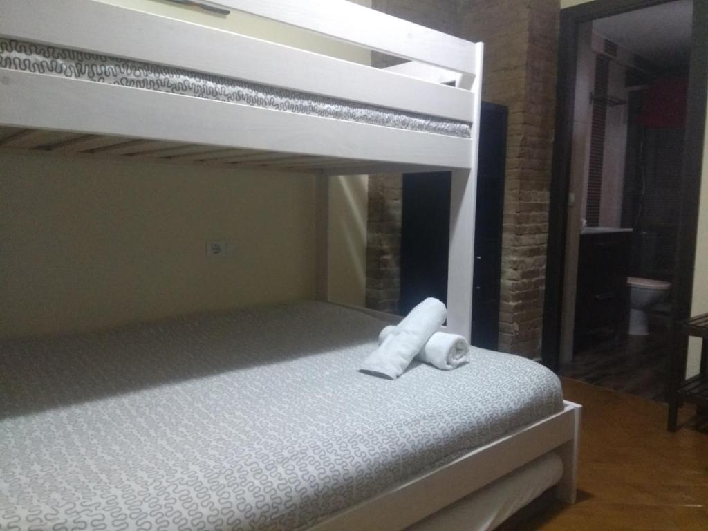 Posteľ alebo postele v izbe v ubytovaní Casa Sevilla Nervión-Centro