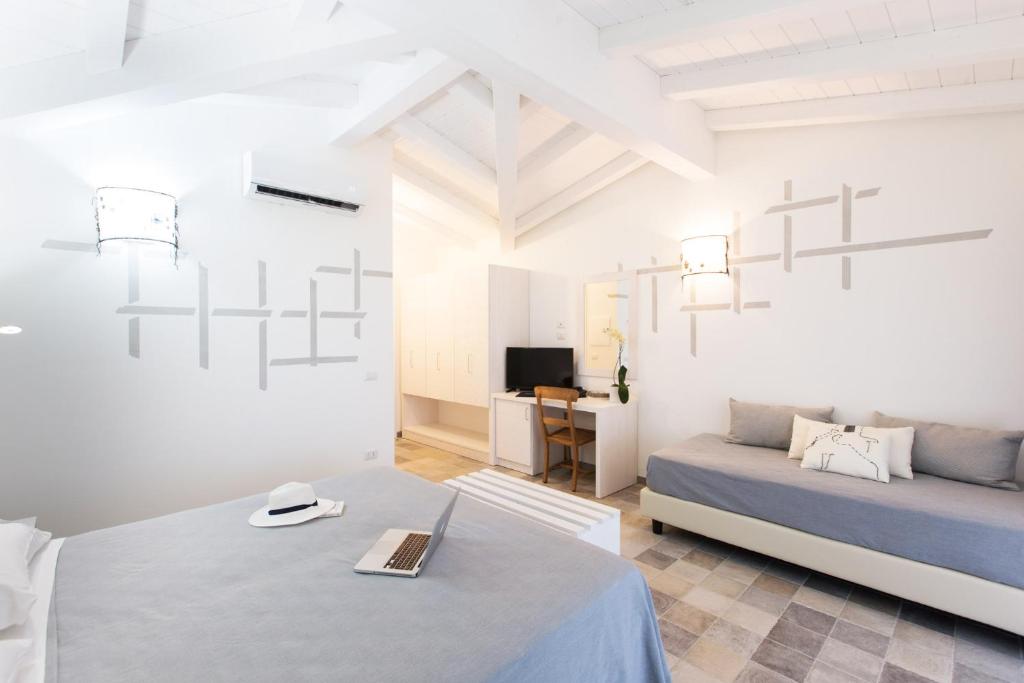 A bed or beds in a room at Perdepera Resort