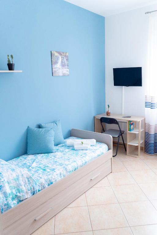 Telewizja i/lub zestaw kina domowego w obiekcie B&B Alle Falde Dell'Etna