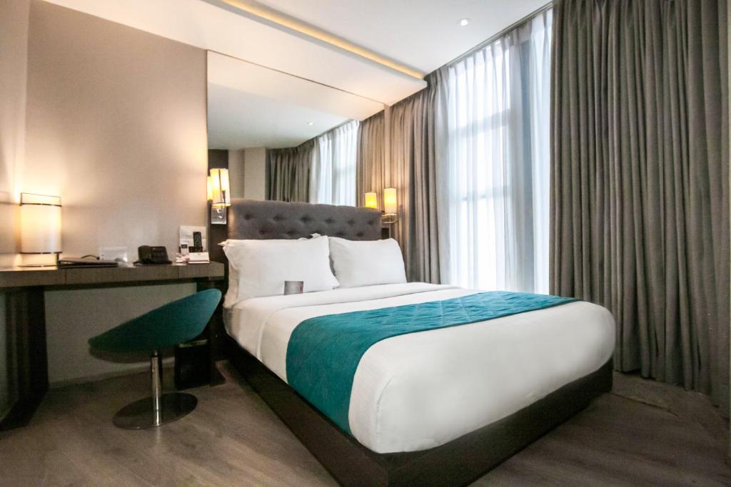 Postel nebo postele na pokoji v ubytování Hotel XYZ