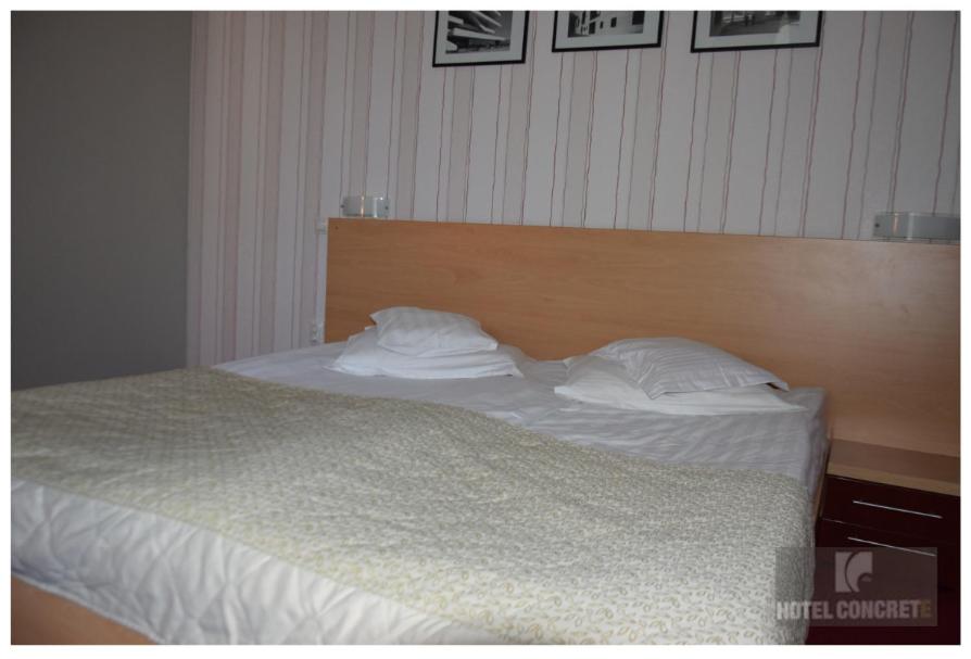 Postel nebo postele na pokoji v ubytování Hotel Concrete