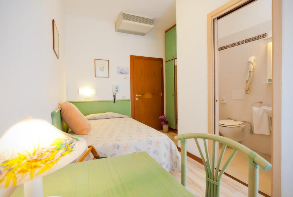 Postel nebo postele na pokoji v ubytování Hotel Excelsior