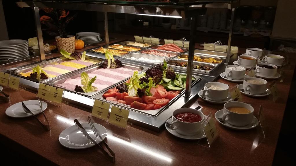 a buffet with many different types of food on a table at Grand Peterhof Spa Hotel in Petergof