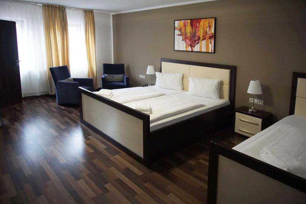 Postel nebo postele na pokoji v ubytování Hotel Corona