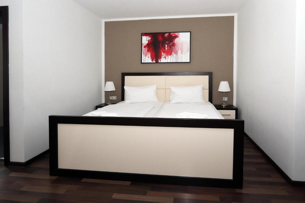 Postel nebo postele na pokoji v ubytování Hotel Corona