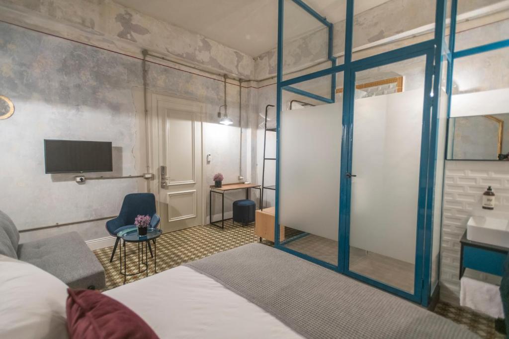 Postel nebo postele na pokoji v ubytování Jojo TLV