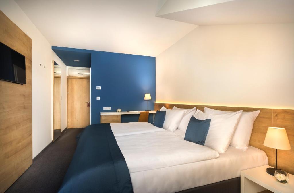 Postel nebo postele na pokoji v ubytování Remisens Hotel Epidaurus-All inclusive