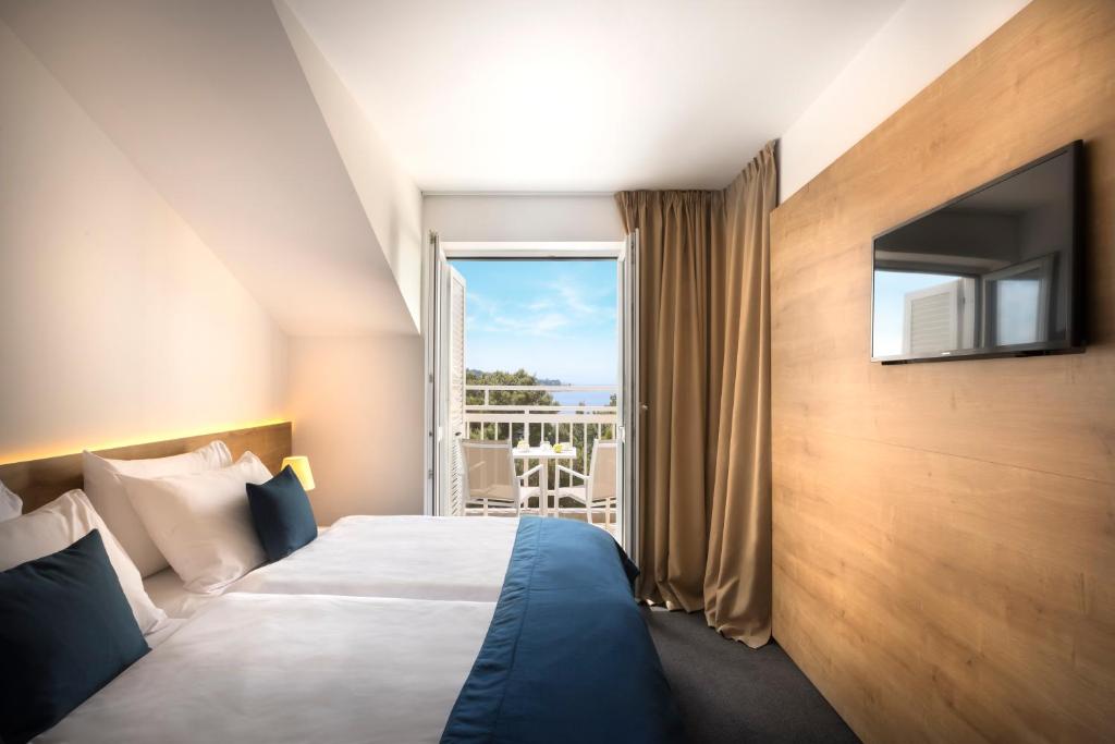 Postel nebo postele na pokoji v ubytování Remisens Hotel Epidaurus-All inclusive