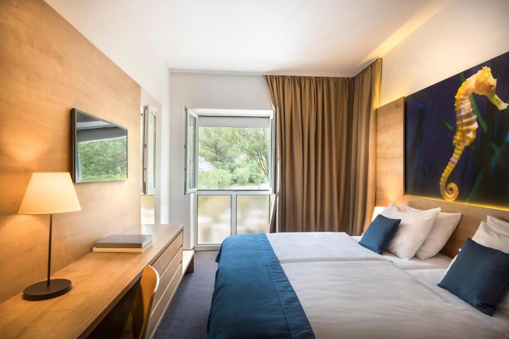 Postel nebo postele na pokoji v ubytování Remisens Hotel Epidaurus-All inclusive