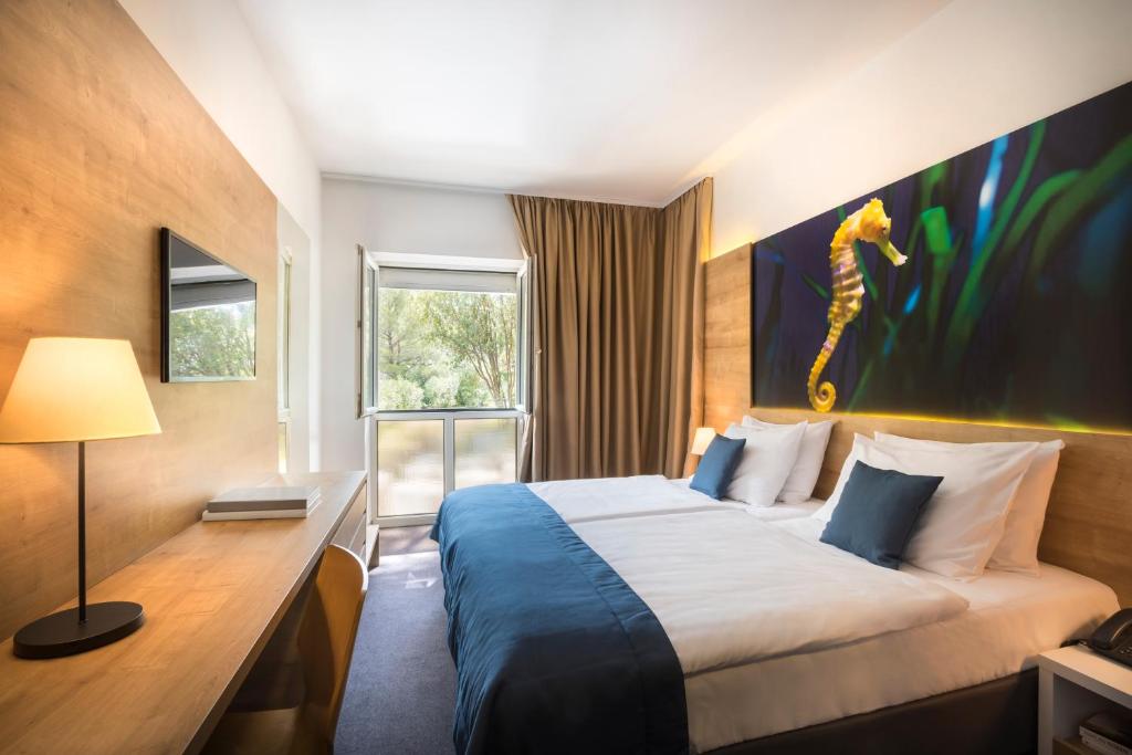Postel nebo postele na pokoji v ubytování Remisens Hotel Epidaurus-All inclusive