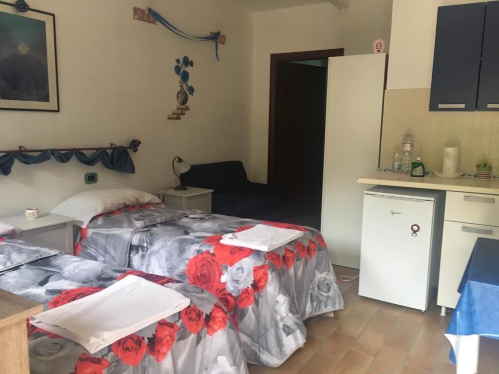 A bed or beds in a room at Agriturismo Fattoria del Colle