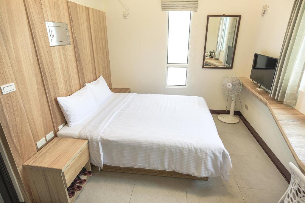Postel nebo postele na pokoji v ubytování Sing Fu Hua Homestay