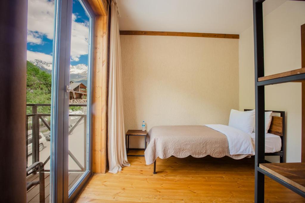 Postel nebo postele na pokoji v ubytování Chalet Mestia