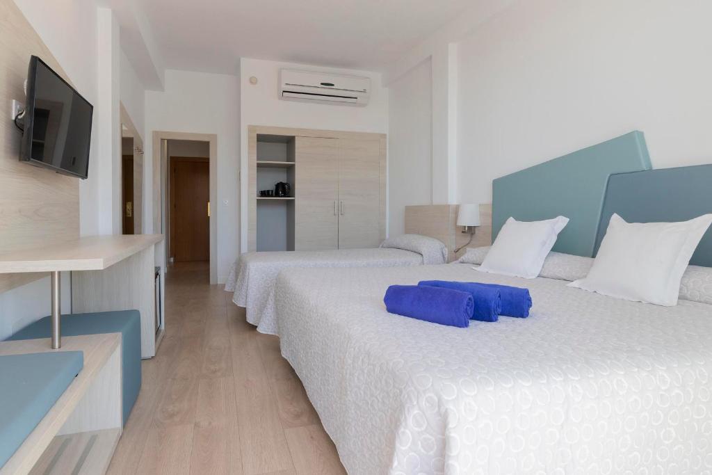 Postel nebo postele na pokoji v ubytování Hotel Palia Las Palomas