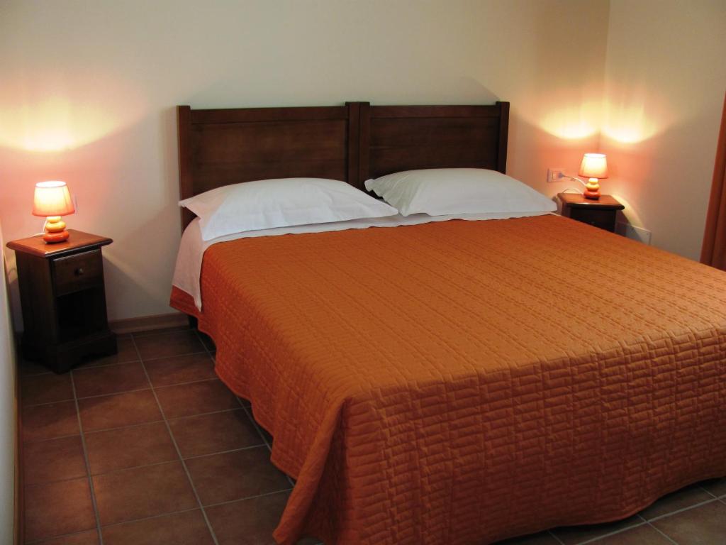 Postel nebo postele na pokoji v ubytování Agriturismo Ai Laghi