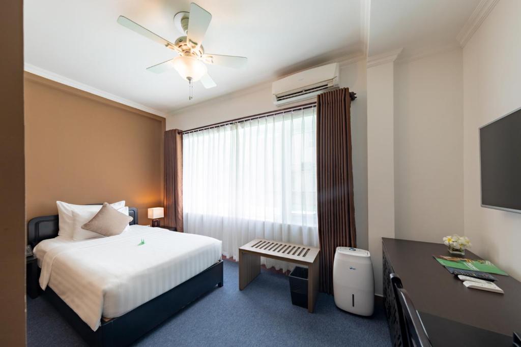 Postel nebo postele na pokoji v ubytování Grandvrio City Danang By Route Inn Group