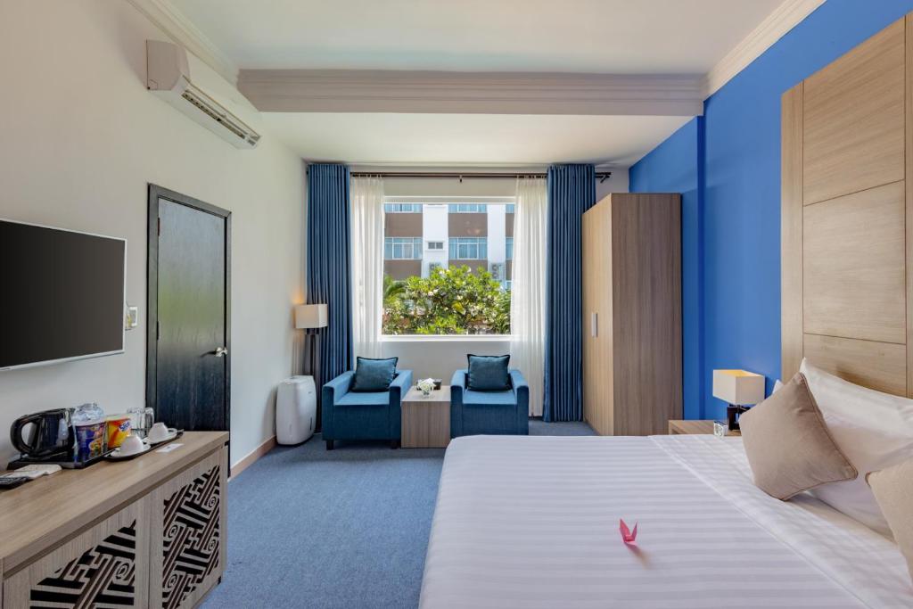 Postel nebo postele na pokoji v ubytování Grandvrio City Danang By Route Inn Group