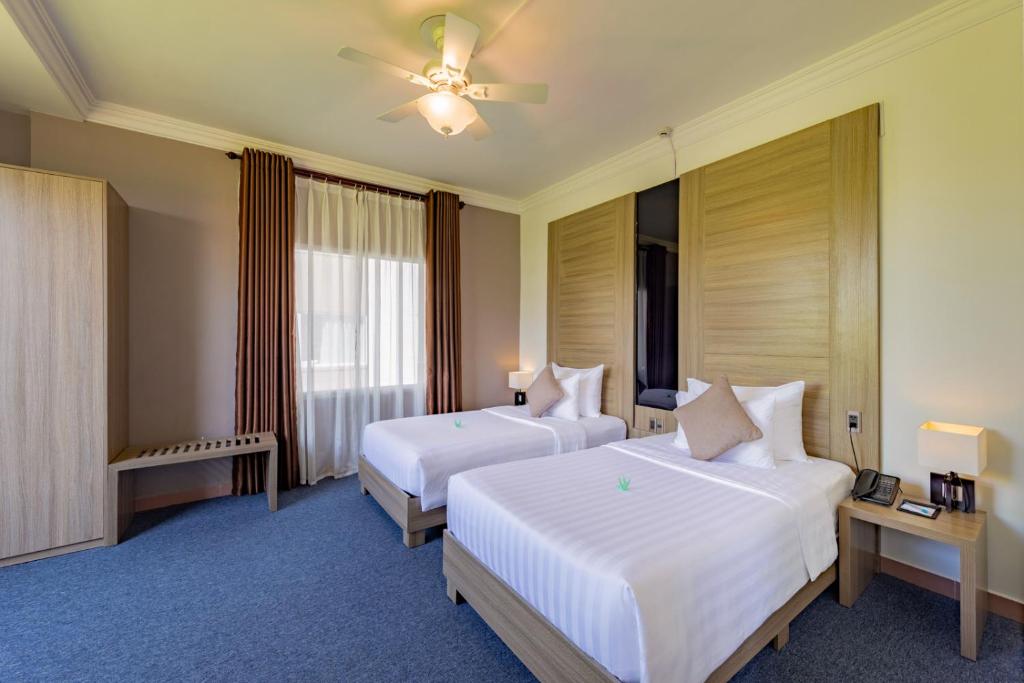 Postel nebo postele na pokoji v ubytování Grandvrio City Danang By Route Inn Group