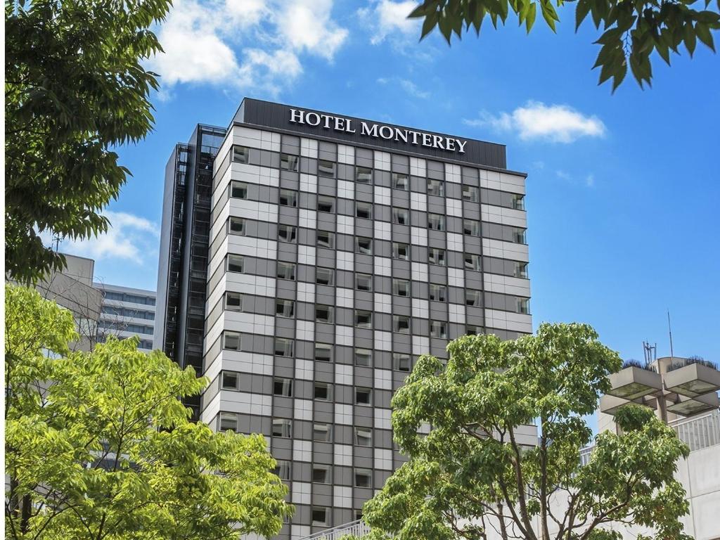 a building with a hotel monopoly sign on it at Hotel Monterey Le Frere Osaka in Osaka