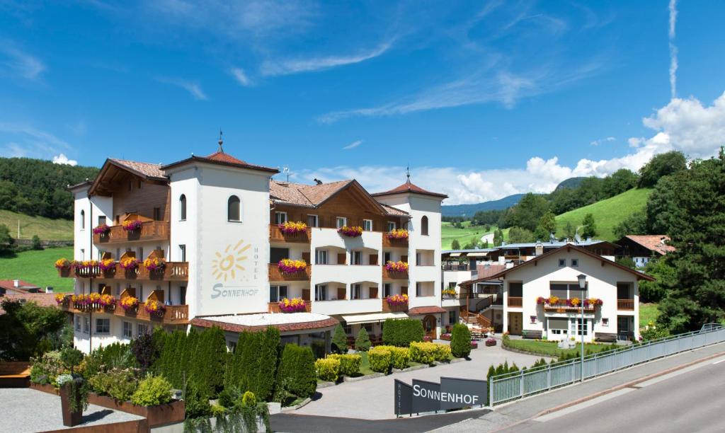 arial view of a hotel in a resort at Hotel Sonnenhof in Castelrotto