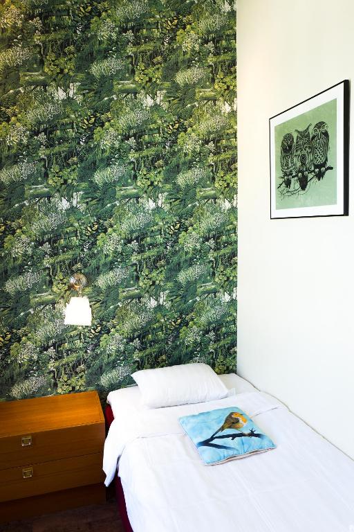 Postel nebo postele na pokoji v ubytování Hotel Finn